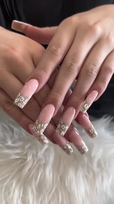 Pink nails with taupe-and-white animal-print French tips